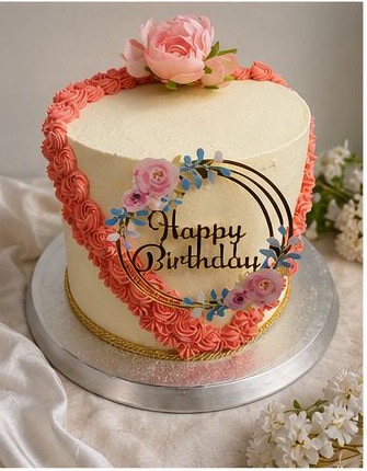 Heart birthday cake with pink piping