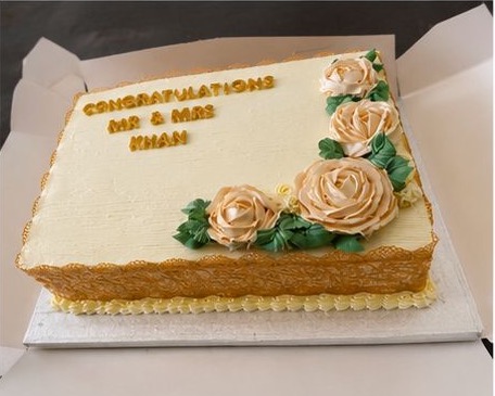 Rectangle congratulations cake with peach buttercream roses