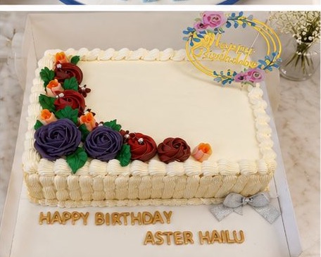 Birthday sheet cake with colourful buttercream flowers