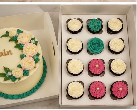 Personalised cake and boxed cupcakes